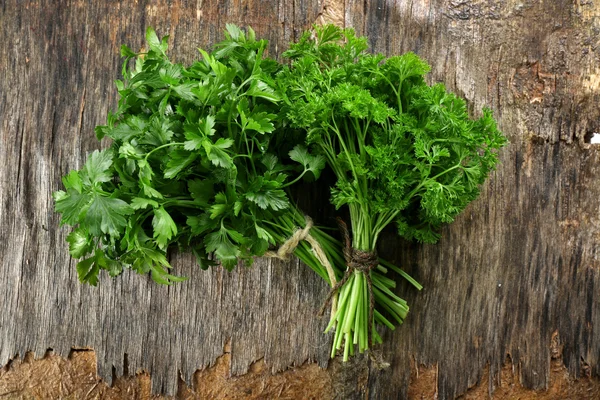 Fresh parsley on wooden background — Stock Photo, Image