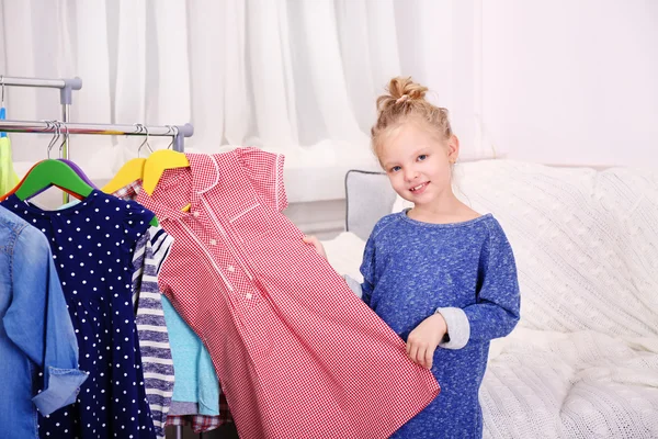 Little girl trying on dress — Stock Photo, Image