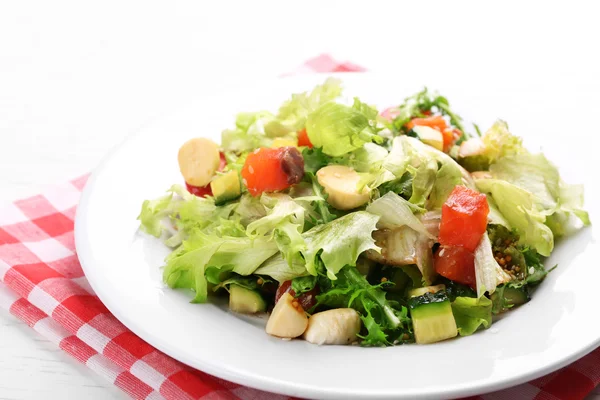 Tasty salmon salad on light wooden background — Stock Photo, Image