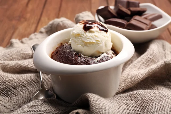 Served table of chocolate lava cake with ice-cream — Stock Photo, Image