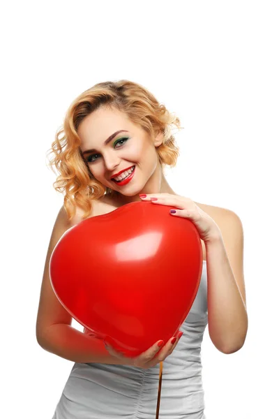 Menina segurando balão coração — Fotografia de Stock