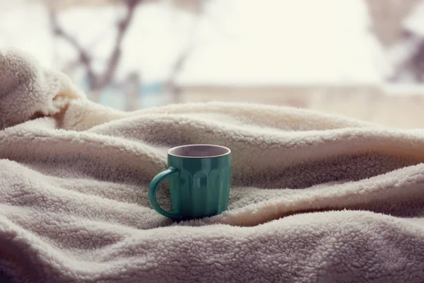 Cup of tea and warm blanket — Stock Photo, Image