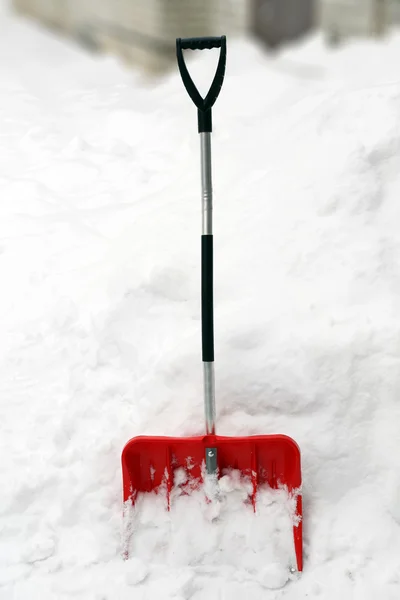 Red shovel for snow removal — Stock Photo, Image