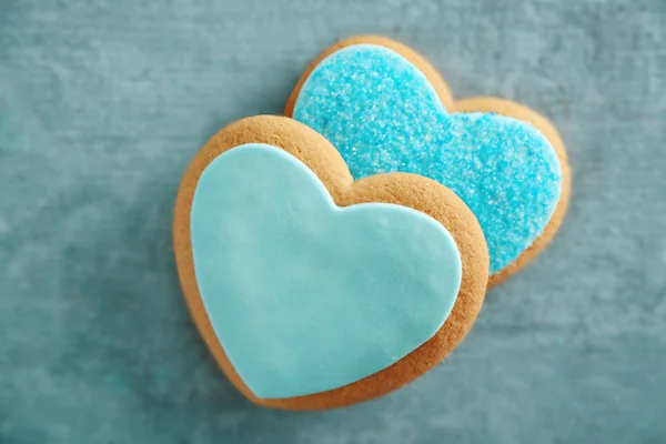 Pliki cookie miłość niebieski na niebieskim tle, zbliżenie — Zdjęcie stockowe