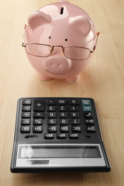 Piggy bank with glasses — Stock Photo, Image