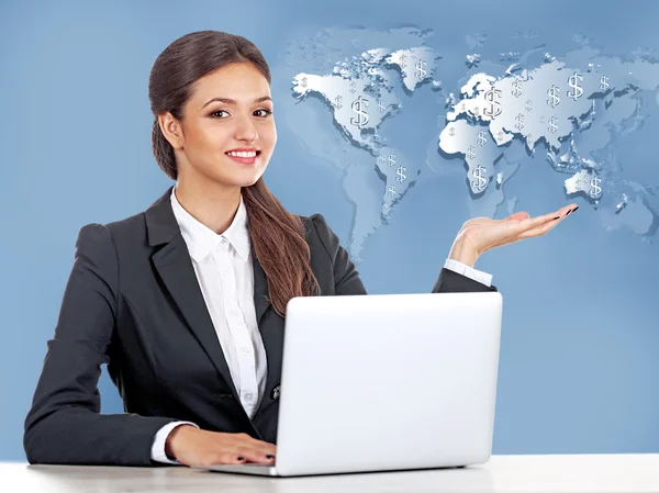 Business lady with laptop on world map — Stock Photo, Image