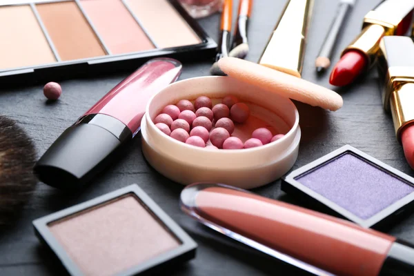 Cosmetics on dark background, closeup — Stock Photo, Image