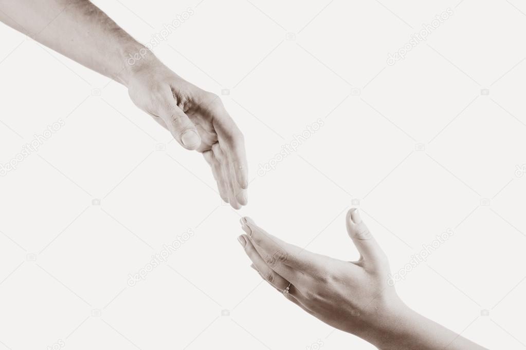 Two hands reaching each other