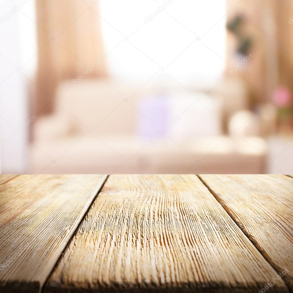 Empty wooden table and blurred interior