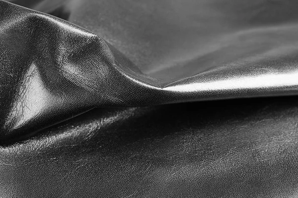 Textur aus schwarzem Leder aus nächster Nähe — Stockfoto