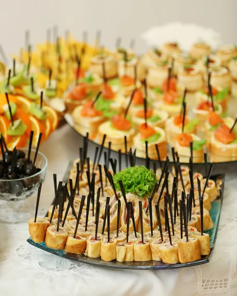 Dish with assorted snacks on a table — Stock Photo, Image