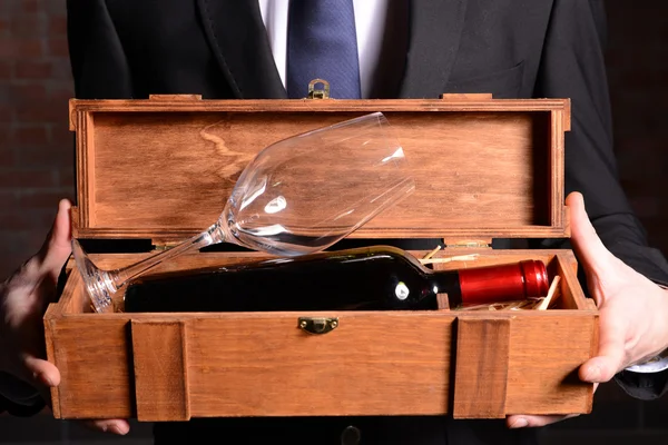 Man holding bottle of red wine — Stock Photo, Image