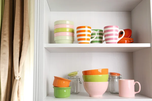 Tableware on shelves in the kitchen — Stock Photo, Image