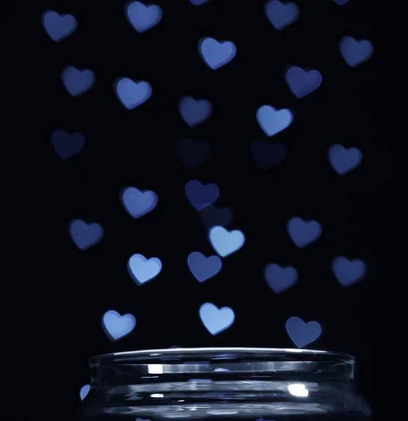 Love magic bottle on black background — Stock Photo, Image
