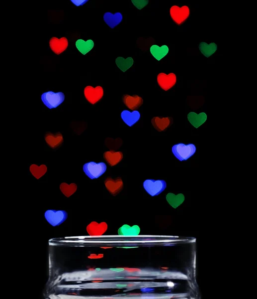 Love magic bottle on black background — Stock Photo, Image