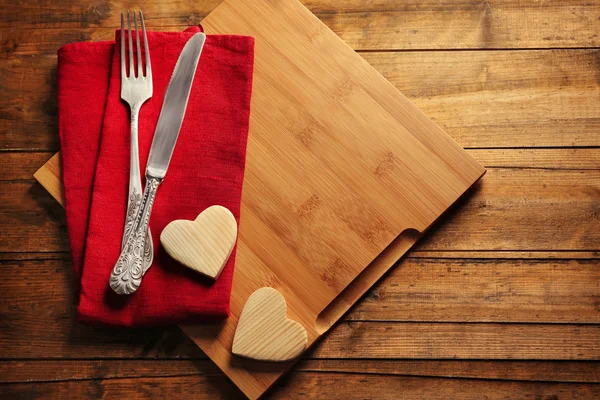 Composition of fork, knife, napkin — Stock Photo, Image