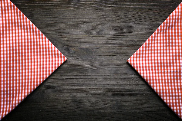 Servilleta a cuadros sobre fondo de madera —  Fotos de Stock