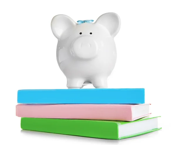 Piggy bank on books — Stok Foto