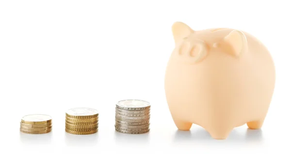 Piggy bank with stack of coins — Stock Photo, Image