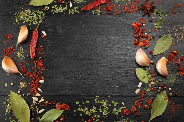 Spices frame on wooden table — Stock Photo, Image