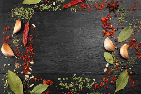 Spices frame on wooden table