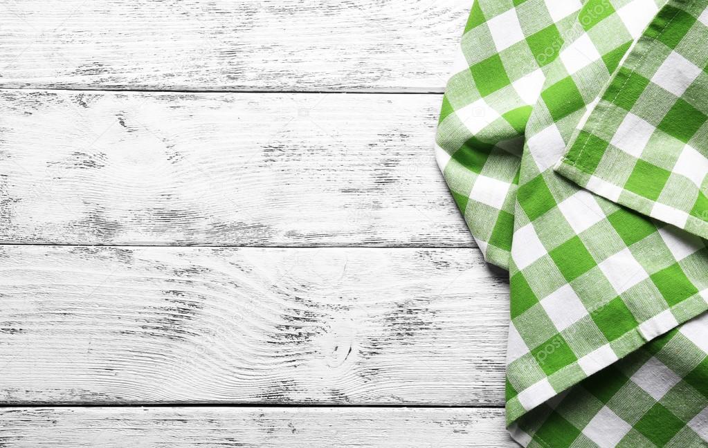 Checkered napkin on wooden background