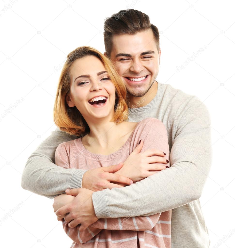 Young couple in love embracing, isolated on white