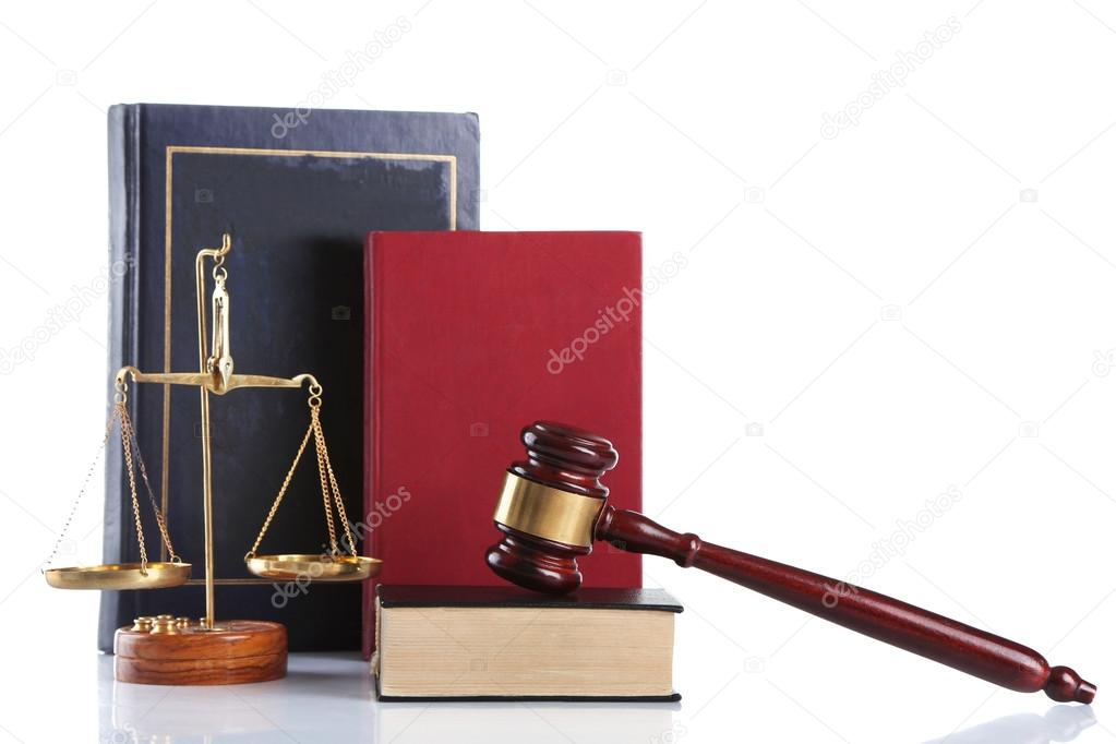 Wooden gavel with justice scales and books, isolated on white