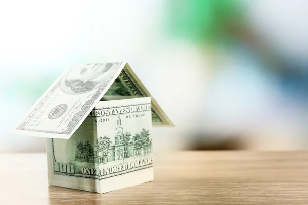 Money house on wooden table, close up — Stock Photo, Image