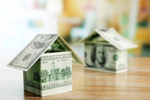 Money house on wooden table, close up — Stock Photo, Image