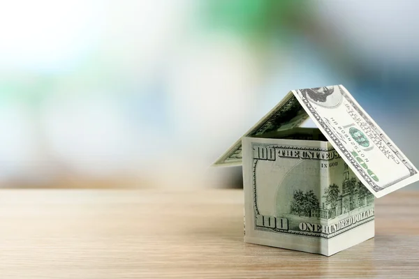 Money house on wooden table, close up — Stock Photo, Image