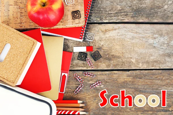 School supplies on old wooden table — Stock Photo, Image