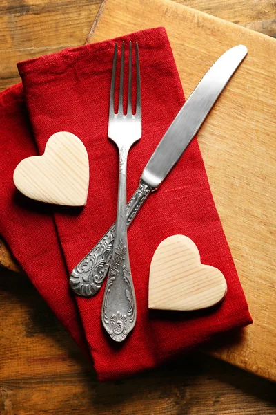Composition of fork, knife, napkin — Stock Photo, Image