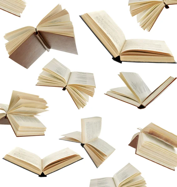 Mnoho létající knihy na bílém pozadí — Stock fotografie