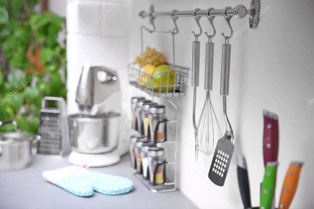 Set of cutlery hanging on wall