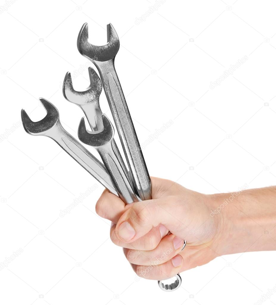 Hand of repairman holding wrenches — Stock Photo © belchonock 102116992