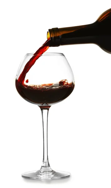 Red wine pouring in glass, isolated on white — Stock Photo, Image