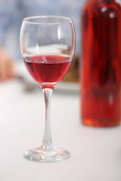 Dinner with glass of wine on table closeup — Stock Photo, Image