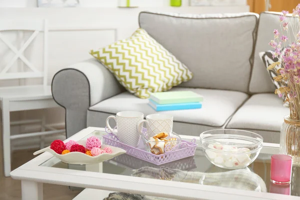 Low table with sweets — Stock Photo, Image