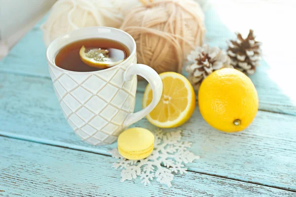 Beautiful winter composition with cup of hot drink, on wooden table — Stock Photo, Image