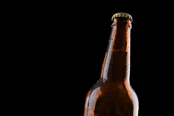 Glass bottle of beer on black background — Stock Photo, Image