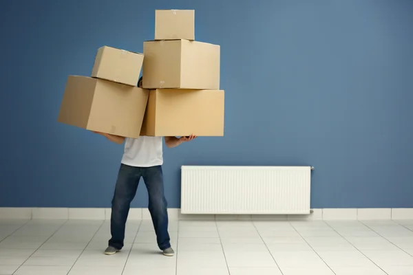 Man holding pile of carton boxes — Stock Photo, Image