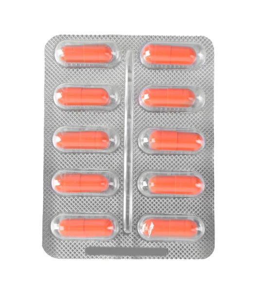 Red pills in the blister pack — Stock Photo, Image