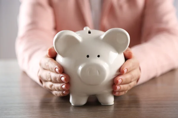 Piggy bank in hands — Stock Photo, Image