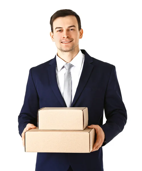 Man in suit holding carton boxes — Stock Photo, Image