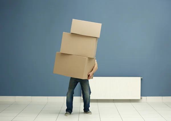 Man holding pile of carton boxes — Stock Photo, Image