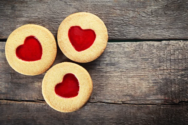 Group of love cookies on wooden background, closeup