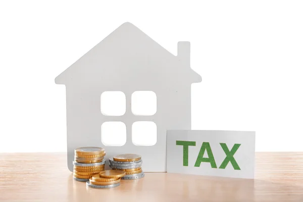 House figure, coins and tax sign — Stock Photo, Image