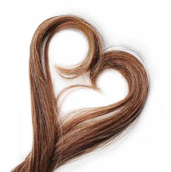 Hilos de cabello castaño en forma de corazón — Foto de Stock