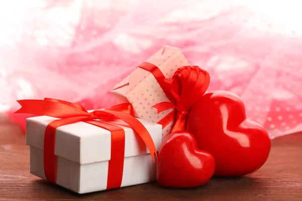 Gift boxes and decorative hearts — Stock Photo, Image